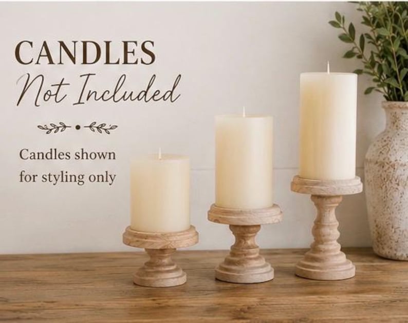 May include: Three cream-colored pillar candles on decorative wooden candle holders. The candle holders have a distressed, carved design. The text in the image reads "CANDLES Not Included" and "Candles shown for styling only."