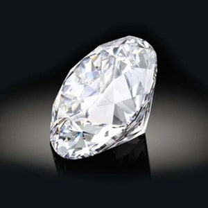 May include: A large, clear, round diamond with many facets. The diamond is set against a black background.
