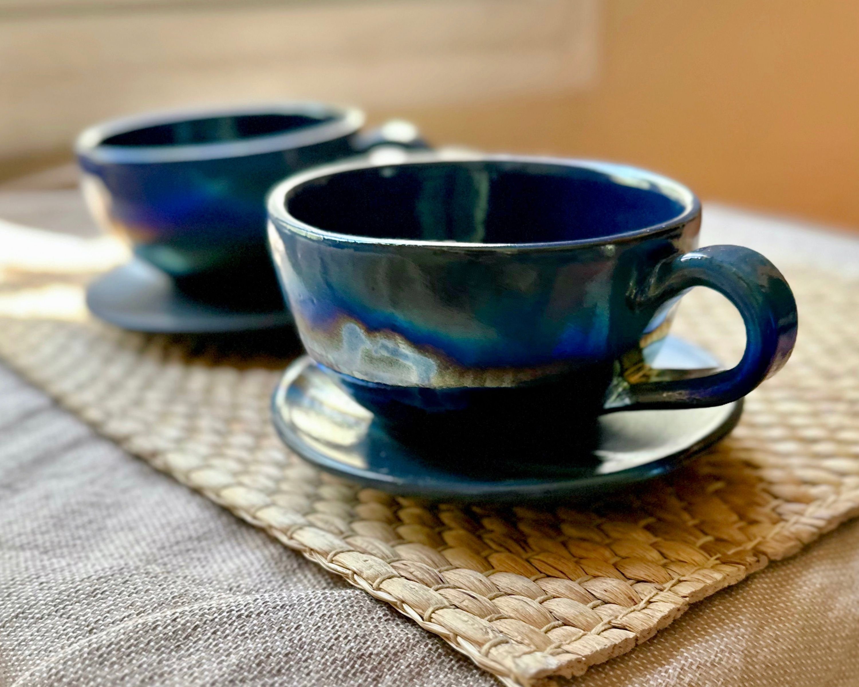 Black Cappuccino Cup With Shades of Blue, and Gold Metallic Luster