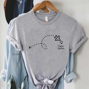 a t - shirt hanging on a clothes rack