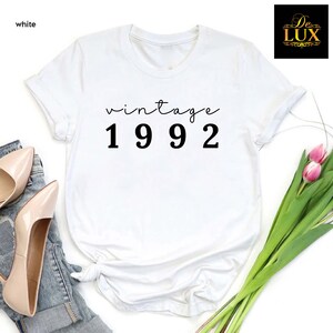 a t - shirt with the words vintage 1932 printed on it