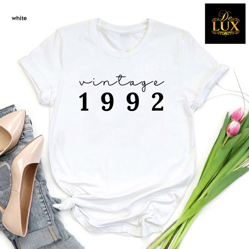 a t - shirt with the words vintage 1932 printed on it