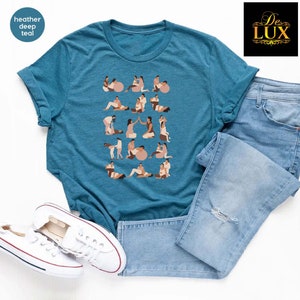 a t - shirt with dogs on it next to a pair of jeans