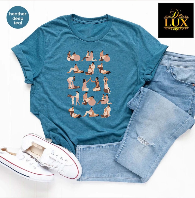 a t - shirt with dogs on it next to a pair of jeans