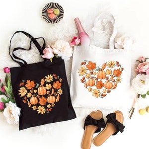 a pair of shoes and a tote bag on a white surface