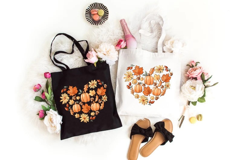 a pair of shoes and a tote bag on a white surface