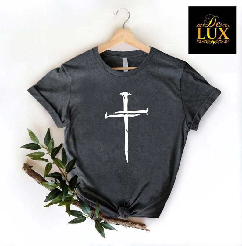 a t - shirt with a cross on it