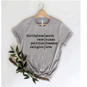 a t - shirt that says, bring earth, raise human political freedom, and