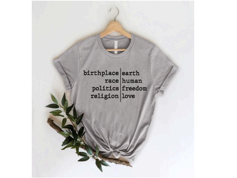 a t - shirt that says, bring earth, raise human political freedom, and