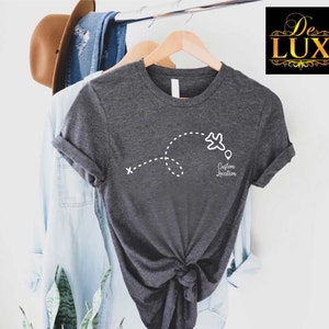 a t - shirt hanging on a clothes rack