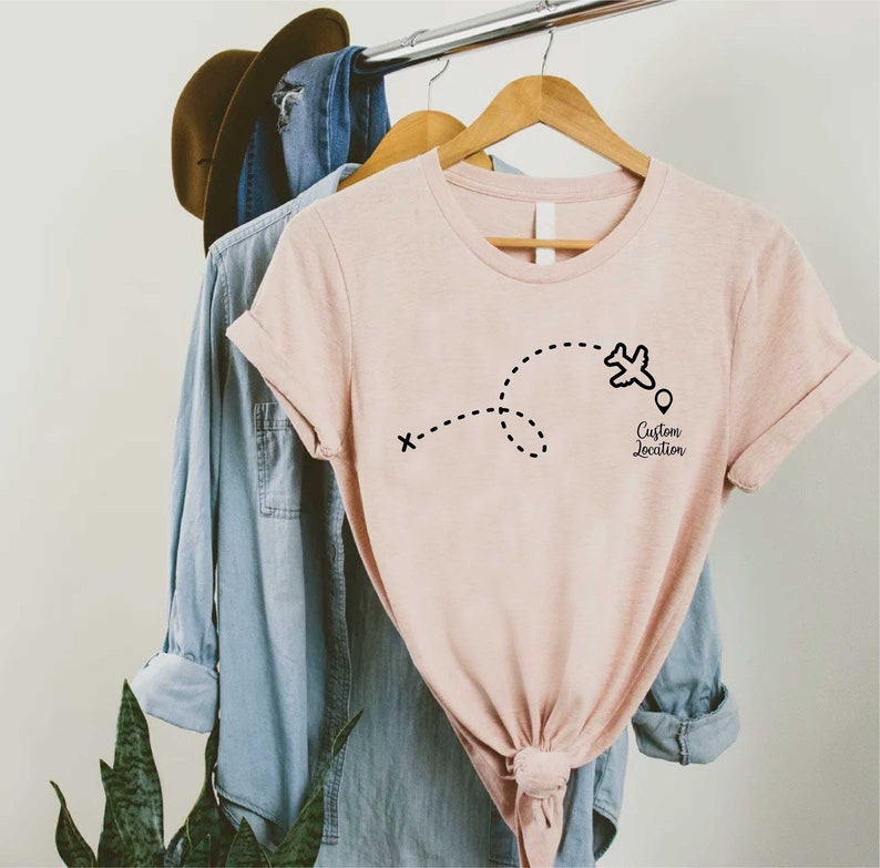 a t - shirt with a picture of a plane on it
