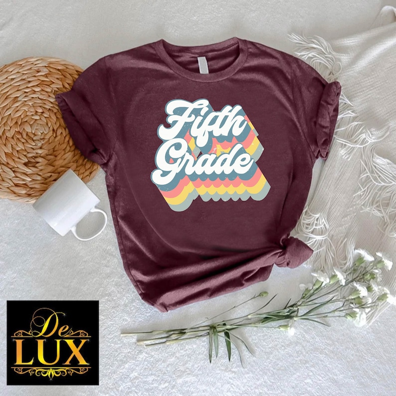 a t - shirt with the words fifth grade on it