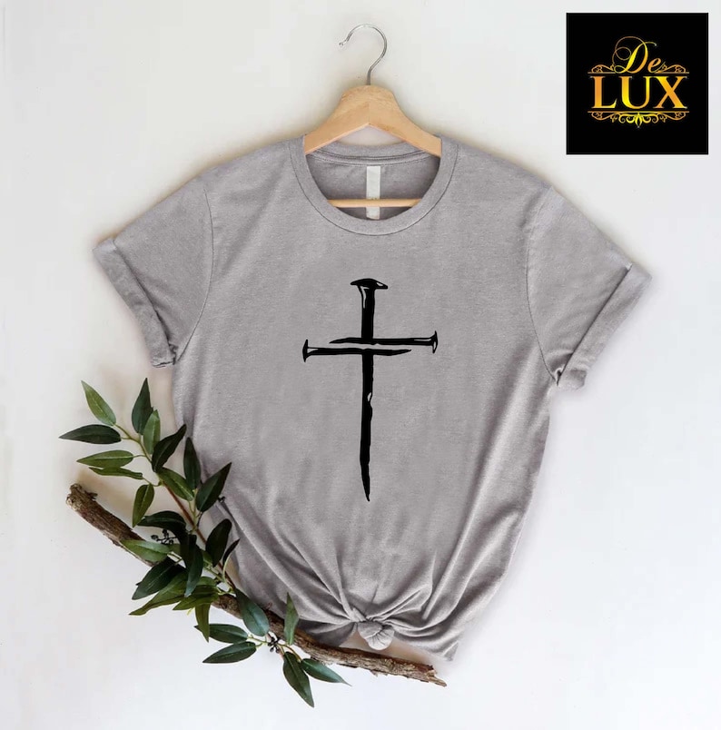 a t - shirt with a cross on it