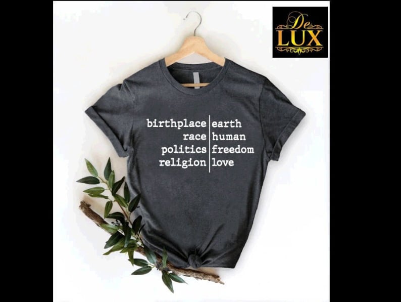 a t - shirt that says, birth place earth, race human, politics freedom