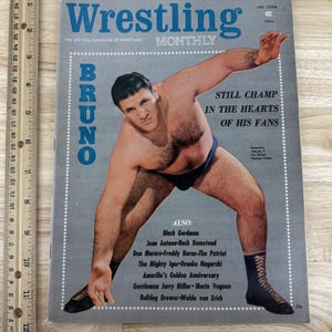 May include: Vintage "Wrestling Monthly" magazine cover featuring a wrestler named Bruno. The cover has a gray background with blue text and a photo of the wrestler in action. Additional text includes "Still Champ in the Hearts of His Fans."
