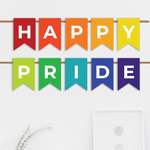 May include: A rainbow banner with the words "Happy Pride" hanging on a white wall above a white desk with a chair.