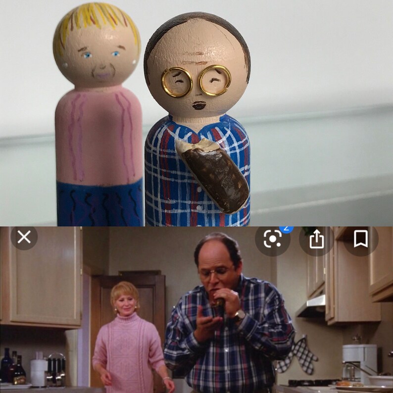 May include: A pair of hand-painted wooden peg dolls depicting a couple. The woman is wearing a pink shirt and blue pants. The man is wearing a blue and red plaid shirt and holding a brown and white ice cream cone.