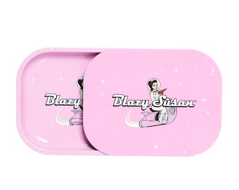 May include: Pink rolling tray with a space-themed design featuring a woman in a spacesuit riding a rocket. The tray has the text "Blazy Susan" printed on it.