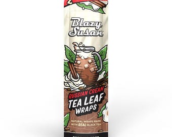 May include: A resealable pouch of Blazy Susan Russian Cream Tea Leaf Wraps. The packaging features a graphic of a drink with cinnamon sticks and cream. The words "Tobacco Free" are printed at the bottom.