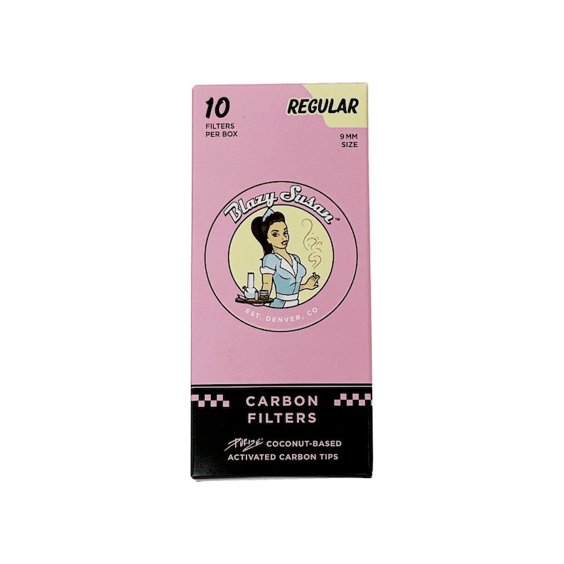 May include: A pink box of Blazy Susan 10 pack of 9mm regular size carbon filters. The box features a cartoon illustration of a woman in a diner uniform. The text on the box reads "Blazy Susan", "EST. DENVER, CO", "CARBON FILTERS", "RIDE COCONUT-BASED", and "ACTIVATED CARBON TIPS".