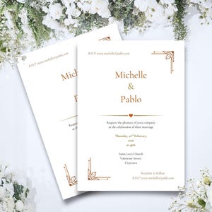 May include: Two white wedding invitations with gold text and decorative corner designs. The invitations read "Michelle & Pablo" and include event details. RSVP information is also included.