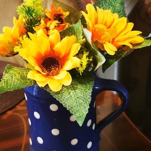 Hand arranged vintage blue polka dot ceramic tankard with artificial sunflowers, shabby chic, French vintage, home decor, floral arrangement