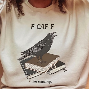 Literary Raven Sweatshirt | Cozy Reading Apparel, Funny Gift for Book Lovers, Raven Art Crewneck, Reading Sweatshirt, Bookworm Gift