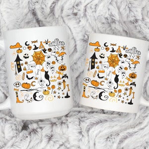 May include: Two white coffee mugs with black and orange Halloween themed illustrations. The illustrations include ghosts, pumpkins, bats, spiders, candy corn, and other Halloween symbols.