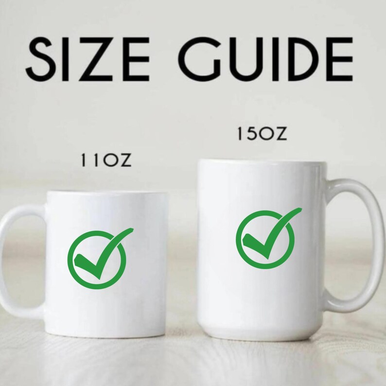 May include: A size guide graphic with the text "SIZE GUIDE" in black. Two white mugs are shown, one labeled "11OZ" and the other "15OZ". Each mug has a green checkmark symbol inside a circle.