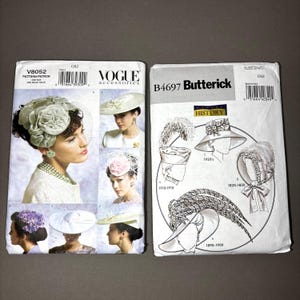 May include: Two vintage sewing pattern envelopes. The Vogue Accessories pattern features images of women wearing hats. The Butterick pattern shows historical hat styles from the 1820s to the 1920s. Both patterns are on a gray background.