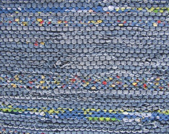 Handwoven Blue Rug with hints of red and yellow