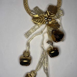 May include: A set of three ceramic mugs with a speckled, matte finish. The mugs are in shades of cream, light gray, and dark gray. Each mug has a simple, minimalist design, perfect for coffee or tea.