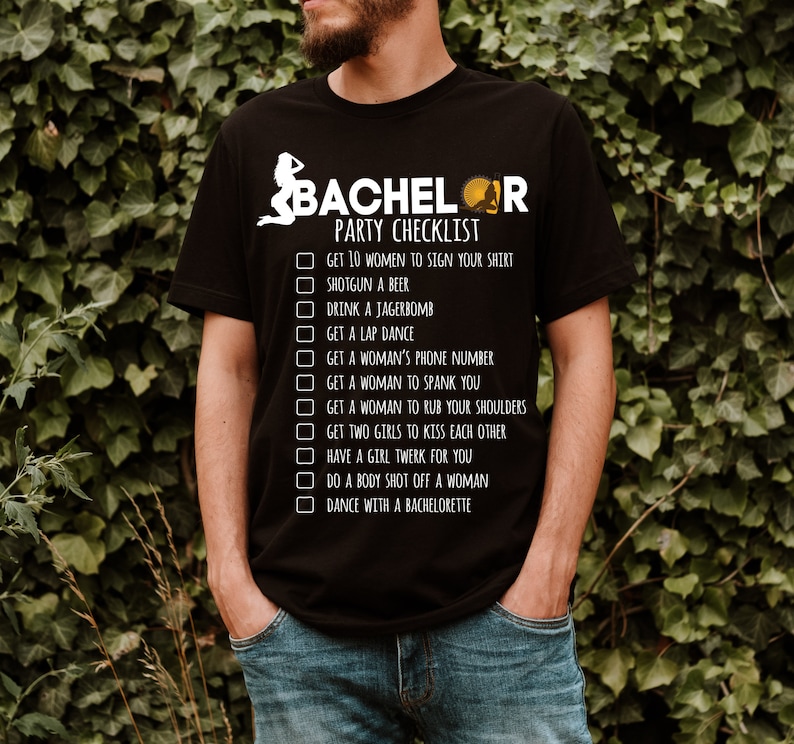 May include: A black t-shirt with a white graphic that says "Bachelor Party Checklist" and lists a humorous checklist of things to do at a bachelor party.