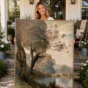 May include: A large rectangular landscape painting in a thin gold frame. The artwork features a dark, textured tree in the foreground set against a muted, cloudy sky and a soft blue-toned horizon, rendered with visible, expressive brushstrokes.
