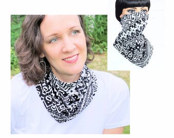 May include: A black and white patterned face mask with a geometric design. The mask is made of a soft, stretchy fabric and is designed to be worn around the neck and pulled up over the nose and mouth.