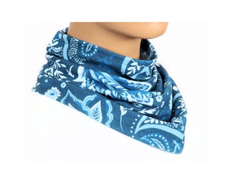 May include: A blue neck gaiter with a white floral pattern. The gaiter is made of a soft, stretchy fabric and can be worn as a scarf, headband, or face mask.