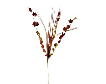 May include: A single stem of artificial fall foliage with red and gold leaves. The leaves are made of metallic material and are arranged in a cluster at the top of the stem.