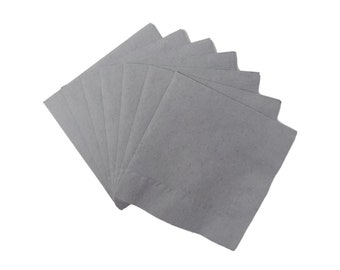 Puede incluir: Un paquete de servilletas de papel grises, dobladas y dispuestas en forma de abanico.