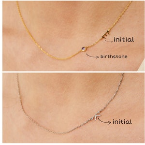 May include: Two gold necklaces with a birthstone and initial charm. The top necklace is gold with a pink birthstone and the letter "M" charm. The bottom necklace is silver with a clear birthstone and the letter "K" charm.