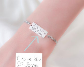 May include: Silver chain bracelet with a rectangular charm that says "I love you James" in handwritten script.