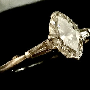 Platinum and Diamonds Size 4.50 to 5.25, Engagement Ring, Marquise Cut 0.91ct Diamond, 8.98 x 5.30 x 3.30mm (depth), with Tapered Baguettes.