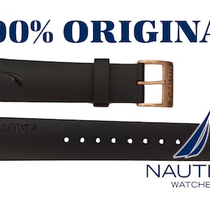 May include: Black watch strap with a rose gold buckle and the word "NAUTICA" embossed on the strap. The strap is shown in two positions, one with the buckle and one without.