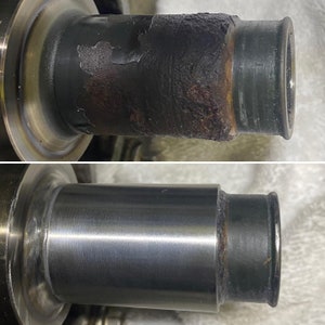 May include: Image comparing a metal component before and after refurbishment. The top part shows a corroded, dark section with peeling. The bottom part displays the same component, now clean and polished, with a shiny, silver appearance.