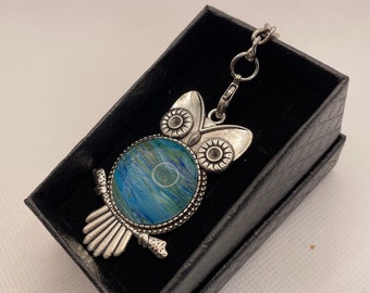 Owl key ring, key chain, bag charm with glass cabochon and acrylic pour fluid art design by Felicity Osborne, boxed gift