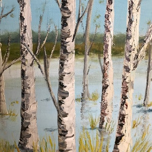 May include: A painting of a birch tree forest with white bark and black markings. The trees are standing in a body of water, with the water level reaching up to the base of the trees. The water is a light blue color, and the sky is a light blue color. The trees are in the foreground of the painting, and the background is a blurry green.