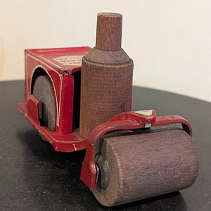 May include: A set of three ceramic canisters with lids. The canisters are white with a blue floral pattern. The largest canister is 8 inches tall, the medium is 7 inches, and the smallest is 6 inches.