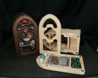 May include: Three wooden dice towers with different designs. The towers are made of walnut and maple wood. The towers have compartments for dice and cards. The towers are a great way to store and organize your dice and cards for tabletop games.