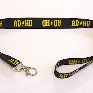 Cordón con correa para el cuello estampado AD/HD (amarillo) de 20 mm