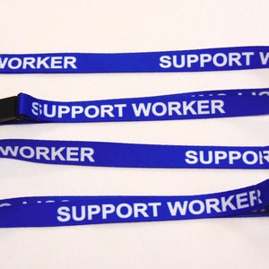 May include: Three blue lanyards with white text that reads "SUPPORT WORKER". The lanyards have a silver clip on one end and a black plastic clip on the other end.
