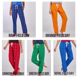 May include: Five pairs of plaid pajama trousers in navy, orange, crimson, green, and royal blue. Each pair has a white drawstring and the text "NAVY FIELD DAY", "ORANGE FIELD DAY", "CRIMSON FIELD DAY", "GREEN FIELD DAY", and "ROYAL FIELD DAY".